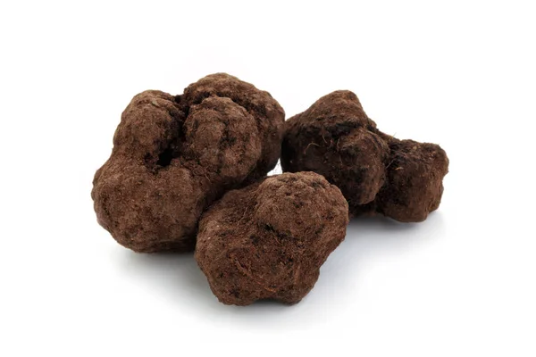 Beyaz üzerine siyah truffles. — Stok fotoğraf
