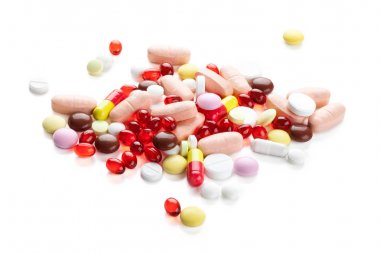 Kırmızı kapsül ve hapları.