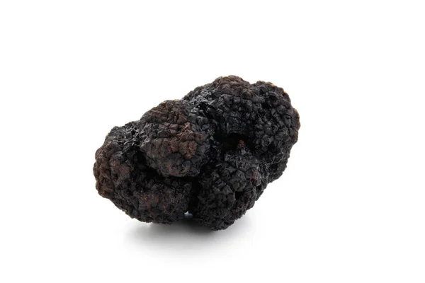 Black truffles on white. — Stock Photo, Image