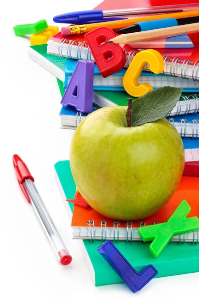 Notebooks and green apple. — Stock Photo, Image