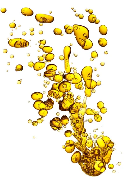 Percikan minyak kuning dalam air . — Stok Foto