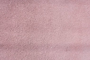Binanın desenli duvarı. Açık pembe duvar.