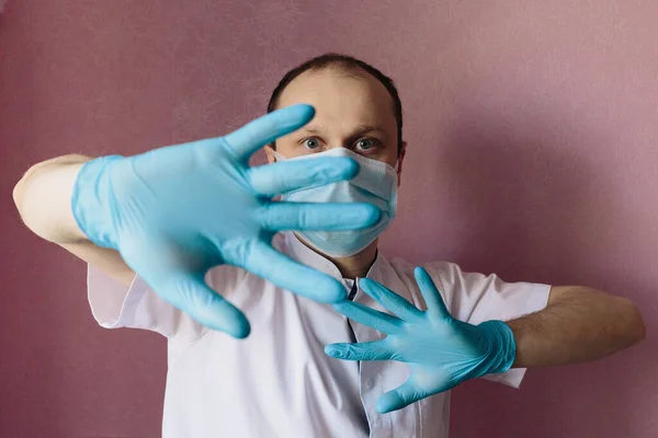 Portrait of a doctor in surgical mask. Stop epidemic. Epidemic infection. Stop coronavirus. Protective reaction.