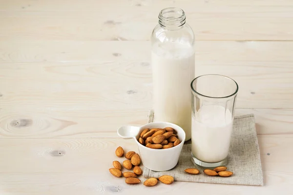 Almond milk and almonds. Vegetarian milk. Copy space.