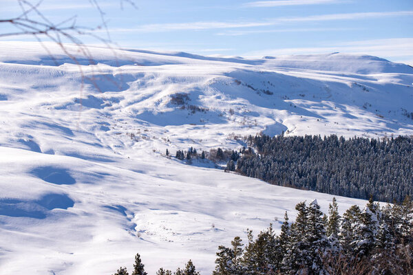 Winter sunset in caucasus mountains in Lagonaki, Adygea, Russia