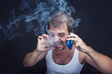 Rude smoking man yelling at his cell phone clipart