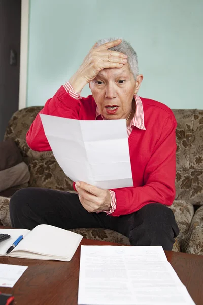 Shocking amount of bills an old lady has to pay for — Stock Photo, Image