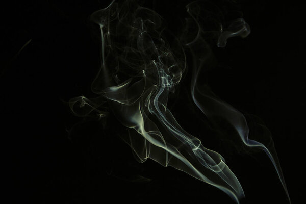 Swirly cloud of smoke on black background, used for design and as various graphic resource