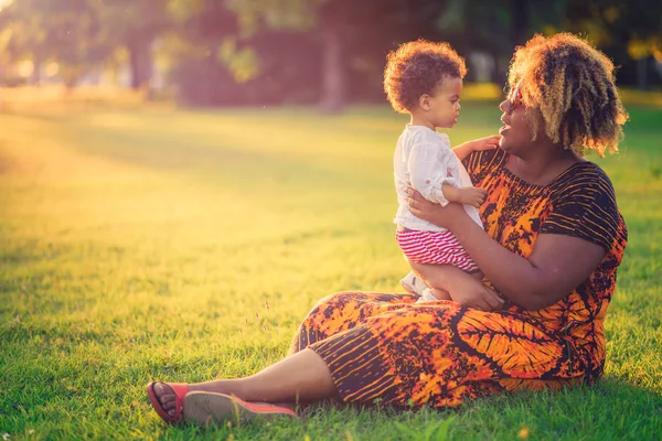 Mother and her daughter having fun in the park