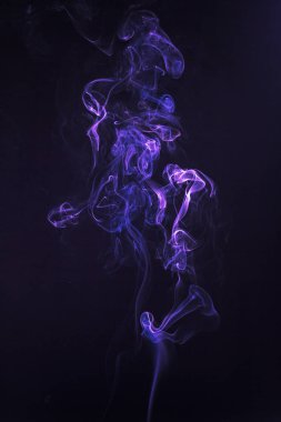 Rich swirls of smoke, black background clipart