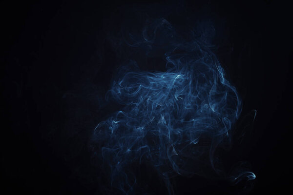 Swirly cloud of smoke on black background, used for design and as various graphic resource