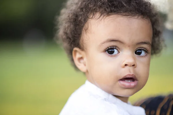 Cute little mixed race baby in the park — Stock Photo, Image