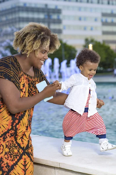 Baby daughters first steps — Stock Photo, Image