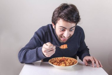 Hungry man eating food clipart