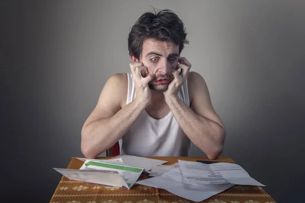 Terrified with bills — Stock Photo, Image