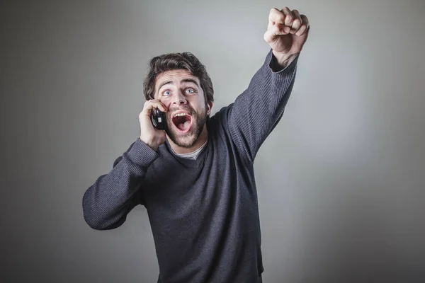 Recebendo grandes notícias vencedoras por telefone — Fotografia de Stock