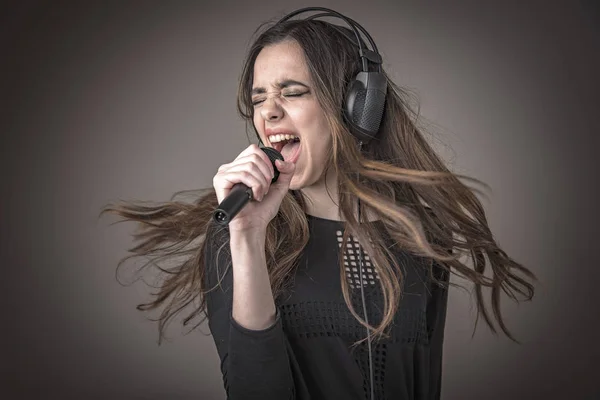 Cute woman singing karaoke — Stock Photo, Image