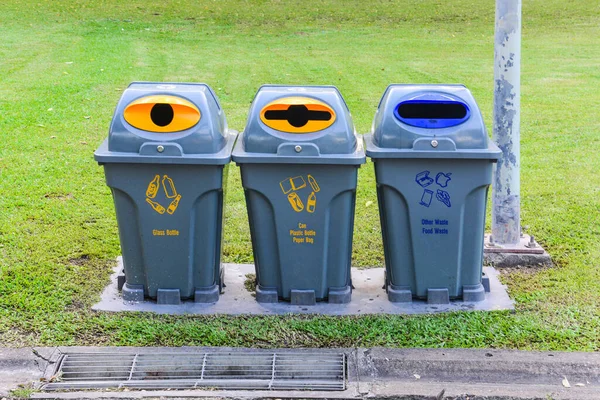 bins in public park, for different garbage (glass, can, plastic, paper and food waste)