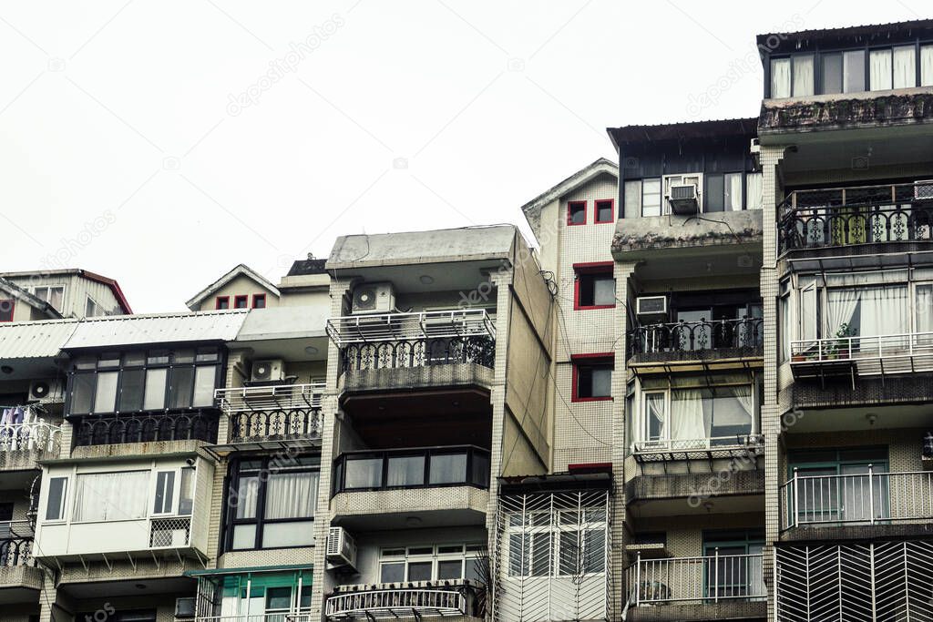 a row of old townhouse, old crowded vintage residential tenement house building in Taipei, Taiwan, isolated on white background, copy space