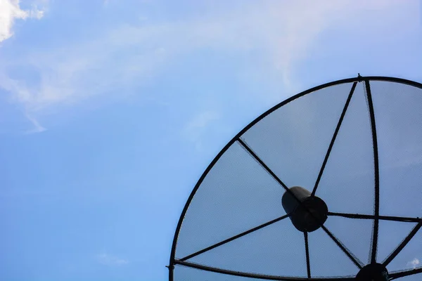 Satellite dish antennas in the bright day, copy space