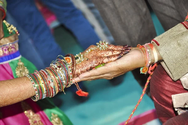 Indian couple's hand in hand in a wedding, Indian marriage traditions