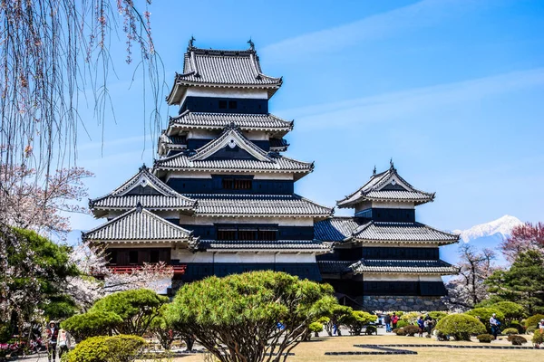 Iconic Matsumoto castle built in traditional japanese style in the middle of high mountain, Japan