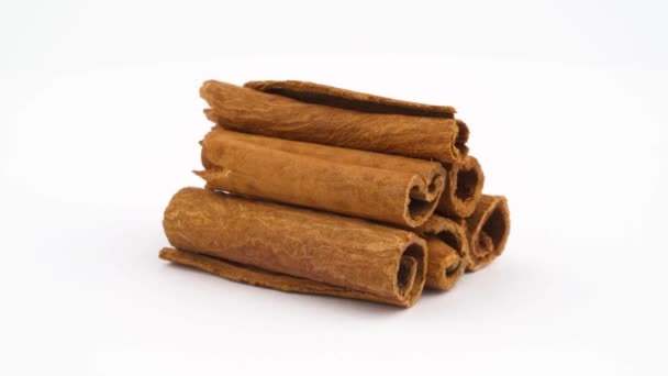 Cinnamon Sticks Pile Rotating Isolated — Stock Video