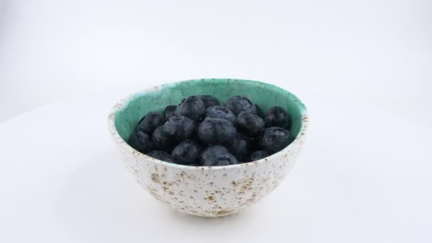 Cup Filled Fresh Blueberries Rotates — Stock Video