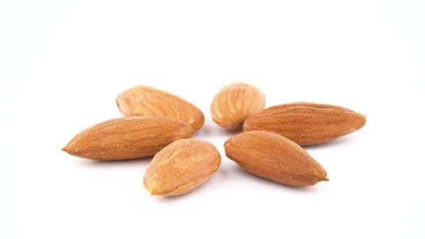 Six Peeled Almonds Slowly Rotating — Stock Video