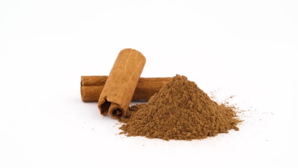 Two Cinnamon Sticks Heap Ground Cinnamon — Stock Video