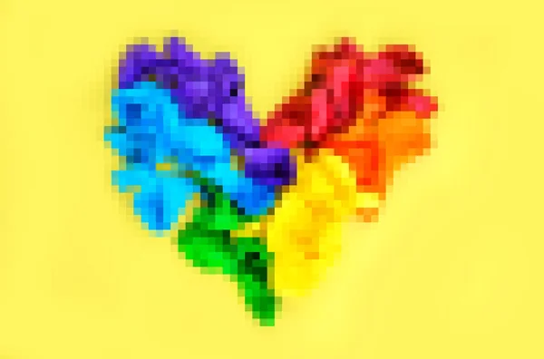 Pixel rainbow heart, like the LGBT rainbow flag on a yellow background with copy space. The concept of human rights and freedoms and LGBT (lesbian, gay, bisexual)