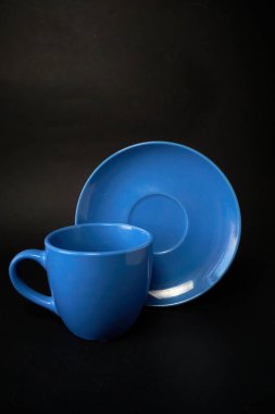 Açık mavi fincan ve çay tabağı.