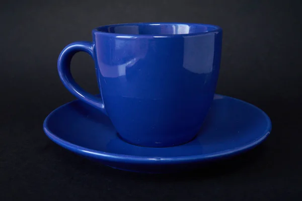 Blue coffee cup with saucer