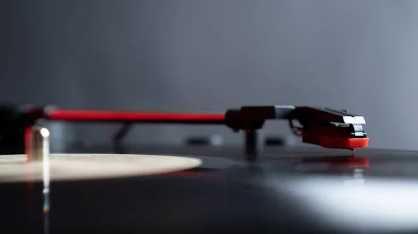 Close up vinyl needle stylus on rotating black vinyl plate or disk with copy space. Turntable vinyl record player. — Stock Photo, Image