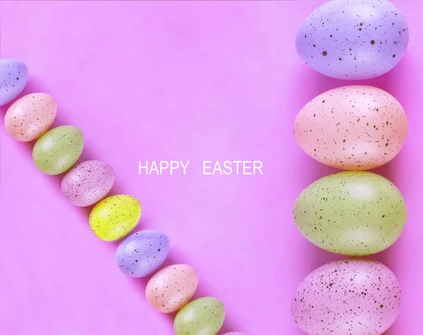 Easter multi-colored eggs on a pink background, Beautiful bright background