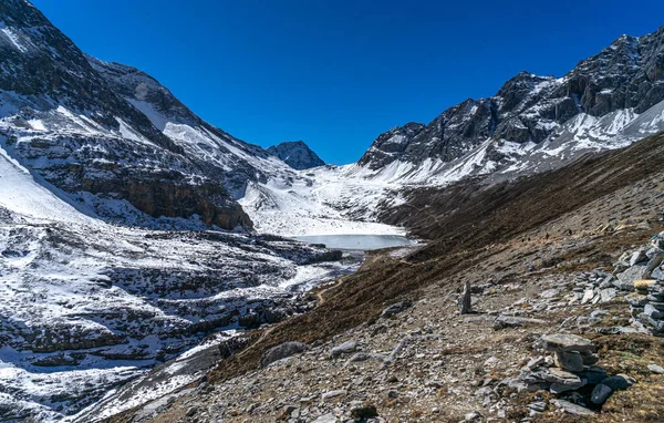 Snow Mountain and dry grass land