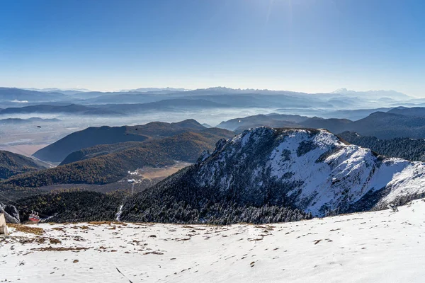 Snow Mountain and dry grass land