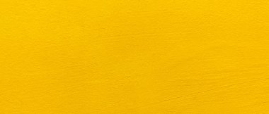 Bulanık sarı sıva duvar arkaplanı. Sarı boyanmış beton duvar dokusu.