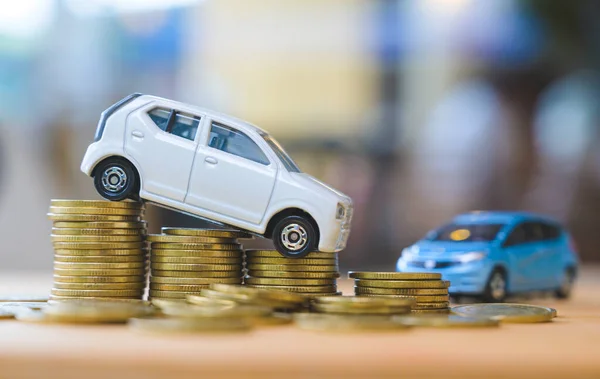 Car on stack of coin. Saving money for car concept. Car finance, buy car new concept.