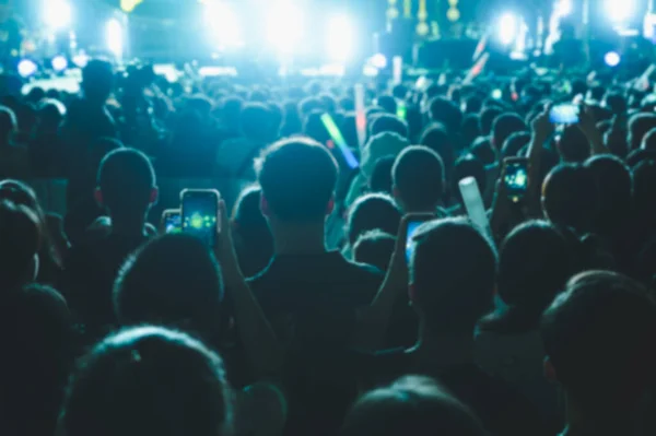 Abstract blurred background of Music concert any people. Crowd attending a concert.