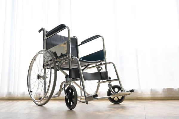 Wheelchair in hospital room background with comfortable medical equipped in a hospital.