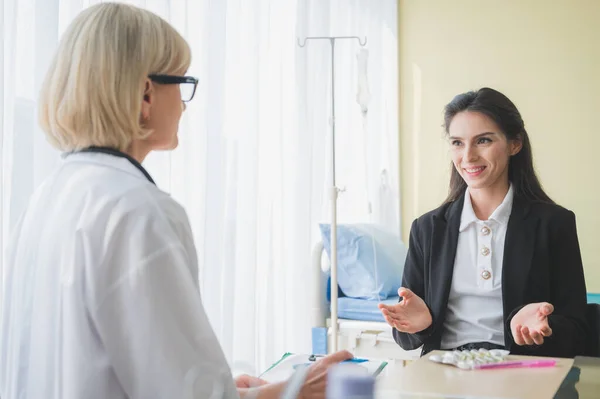 Senior Female Doctor Meet Patient Discussing Making Notes Symptom Problem — Stock Photo, Image