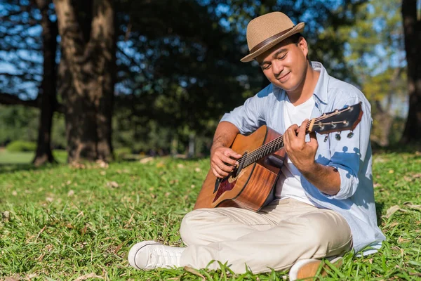Young Asian Man Playing Guitar Park Royalty Free Stock Images