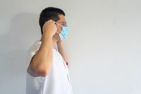 Doctor Nurse Putting Mask Protect Coronavirus Wears Glasses His Uniform — Stock Photo, Image