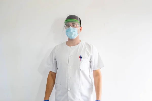 Médico Enfermera Con Escudo Facial Para Protegerse Del Coronavirus Hombre Imágenes De Stock Sin Royalties Gratis