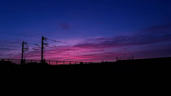 Sunset over train station