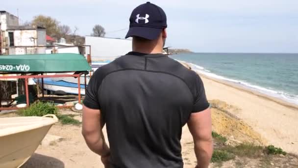 Guy Training Sea Beach Overlooking Sea Sand Boxing Running Talking — Stock Video