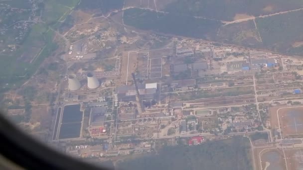 Airplane window view of thermal power station — Stock Video