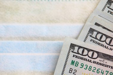 Tıbbi maske ve dolar. Salgın, salgın ve viral enfeksiyonların geçmişi