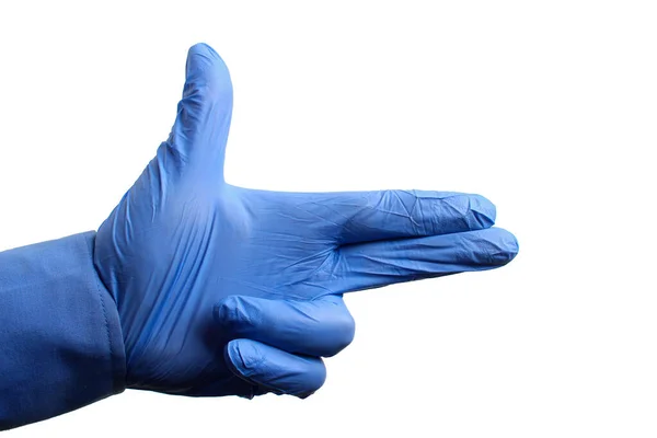 Hand in a medical glove metaphorically depicts a gun on a white background, isolated. Doctor Error Concept